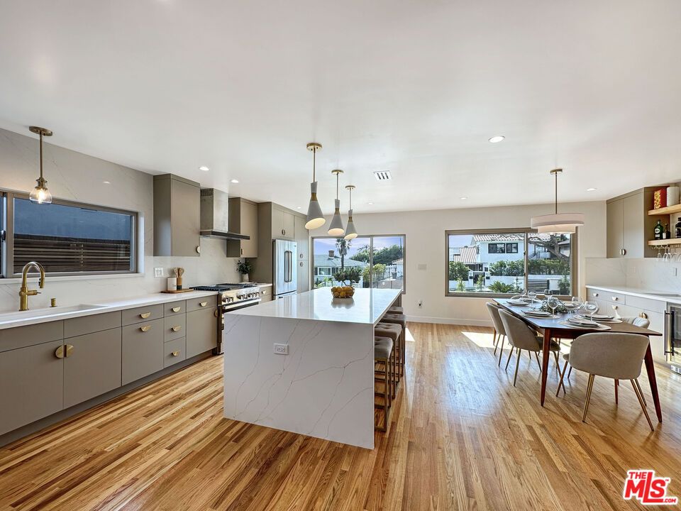 Dining room, Interior, Kitchen, Pendant Lights, Recessed Lighting, Stainless Steel Appliances, Wood Texture Flooring