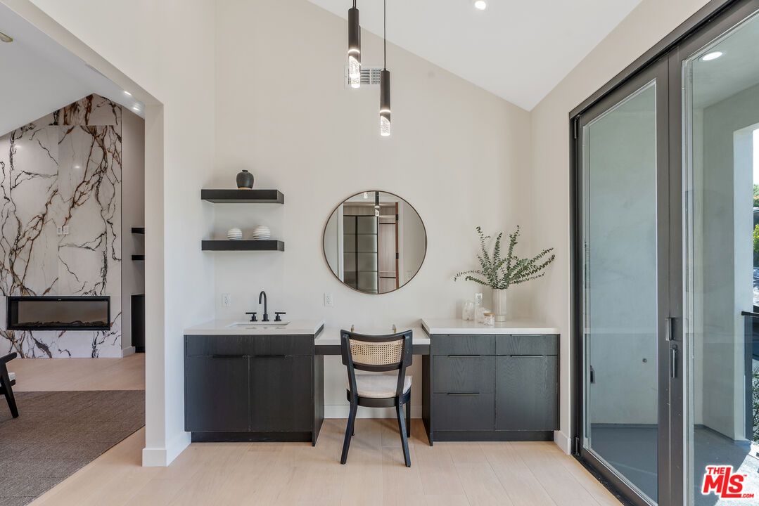 Bathroom, Dual Sink Vanities, Interior, Marble Walls, Pendant Lights, Recessed Lighting, Wood Texture Flooring
