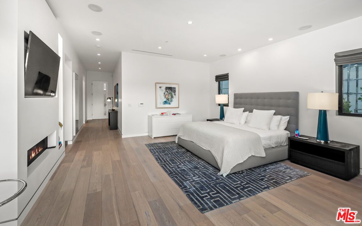 Bedroom, Fireplace, Interior, Recessed Lighting, Wood Texture Flooring