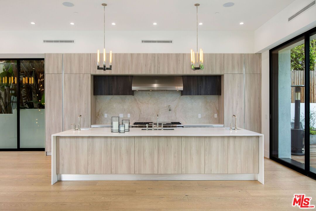 Interior, Kitchen, Marble Walls, Pendant Lights, Recessed Lighting, Stainless Steel Appliances, Wood Texture Flooring