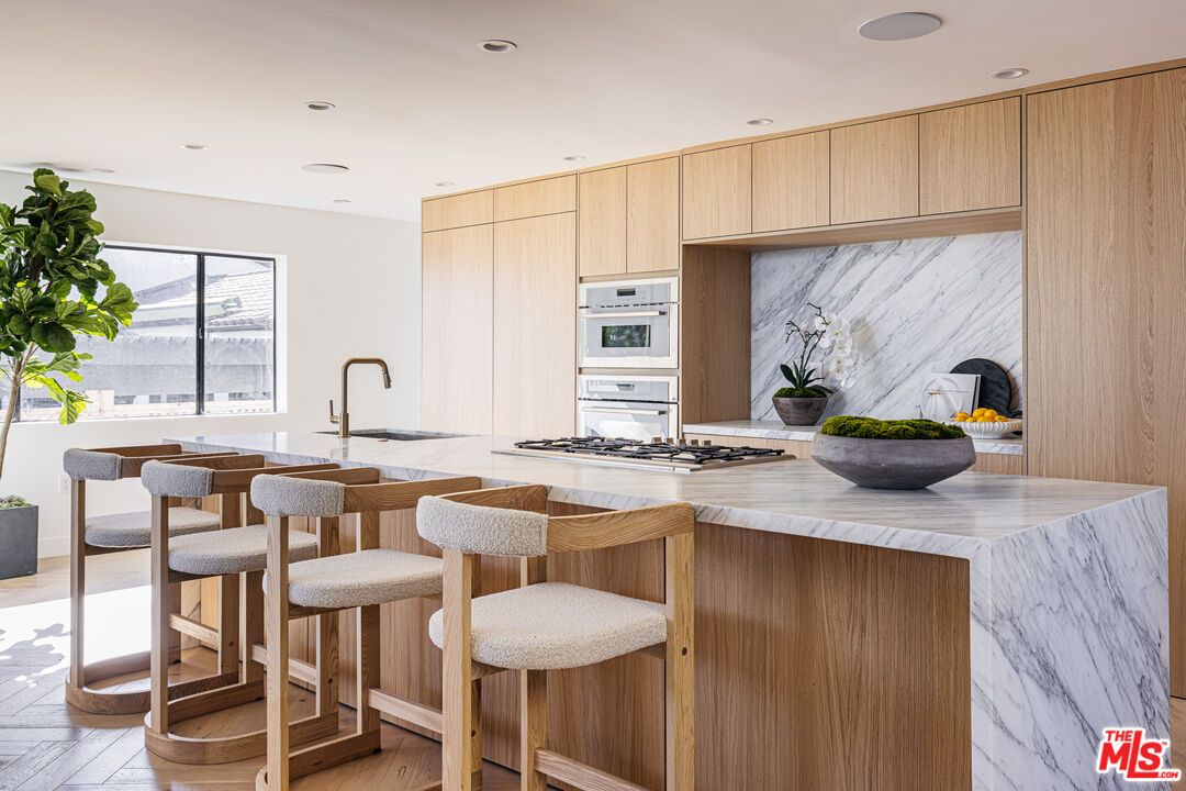 Interior, Kitchen, Marble Walls, Recessed Lighting, Stainless Steel Appliances, Wood Texture Flooring