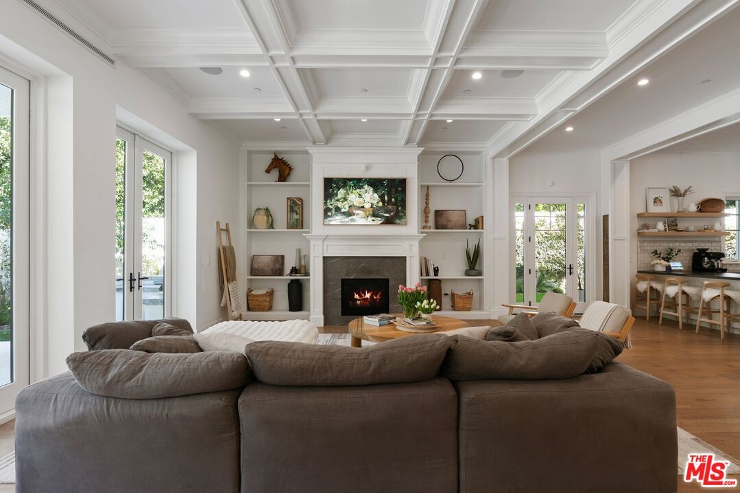 Dining room, Fireplace, Interior, Living room, Recessed Lighting, Wood Texture Flooring