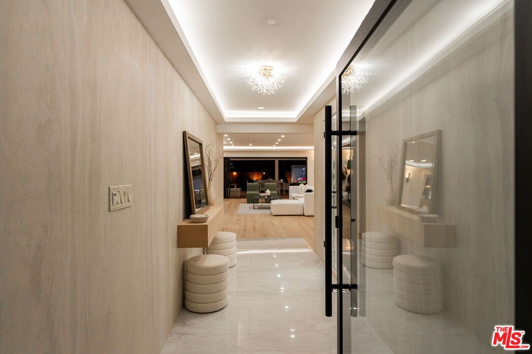 Fireplace, Interior, Living room, Marble Walls, Recessed Lighting, Wood Texture Flooring