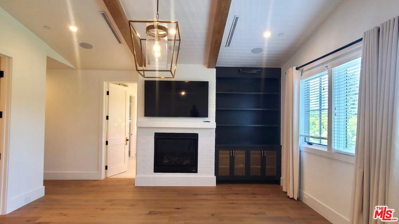 Empty room, Fireplace, Interior, Pendant Lights, Recessed Lighting, Wooden Beams, Wood Texture Flooring