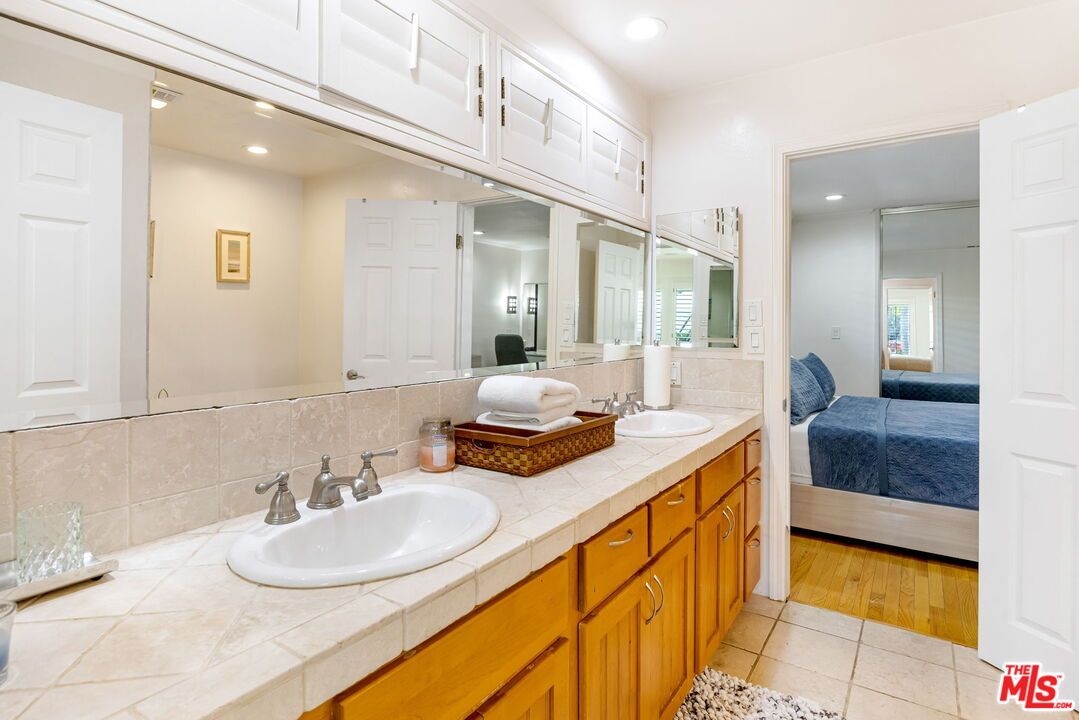 Bathroom, Dual Sink Vanities, Interior, Recessed Lighting, Tile Countertops, Wood Texture Flooring