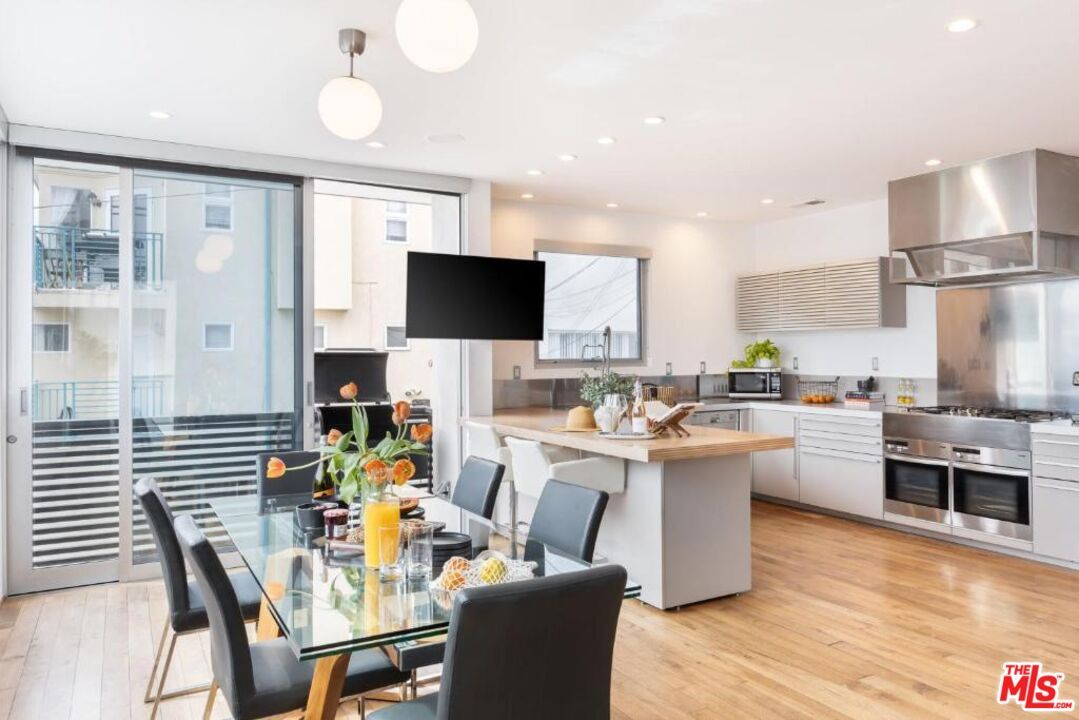 Dining room, Interior, Kitchen, Recessed Lighting, Stainless Steel Appliances, Wood Texture Flooring