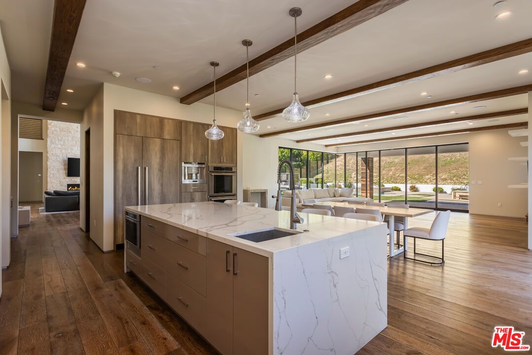 Dining room, Interior, Kitchen, Pendant Lights, Recessed Lighting, Stainless Steel Appliances, Wooden Beams, Wood Texture Flooring