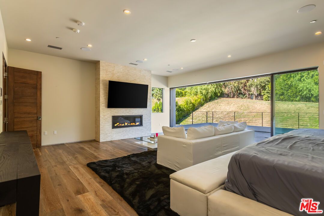 Bedroom, Fireplace, Interior, Living room, Recessed Lighting, Wood Texture Flooring