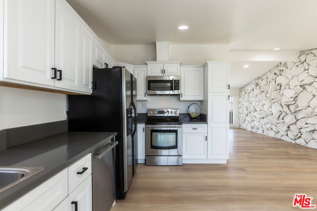 Interior, Kitchen, Recessed Lighting, Stainless Steel Appliances, Stone Walls, Wood Texture Flooring