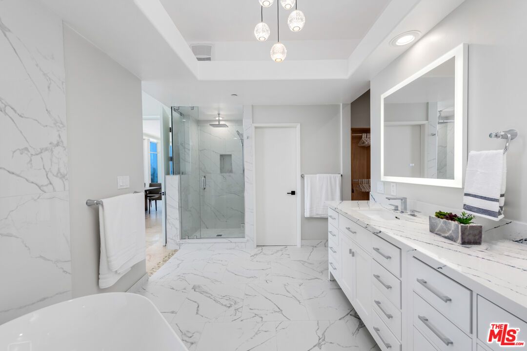 Bathroom, Dual Sink Vanities, Free Standing Baths, Glass Shower, Interior, Marble, Marble Walls, Pendant Lights, Recessed Lighting