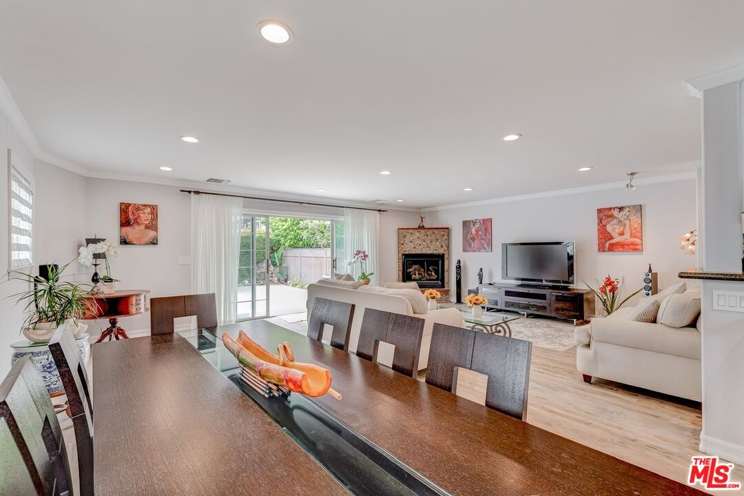 Dining room, Fireplace, Interior, Living room, Recessed Lighting, Wood Texture Flooring