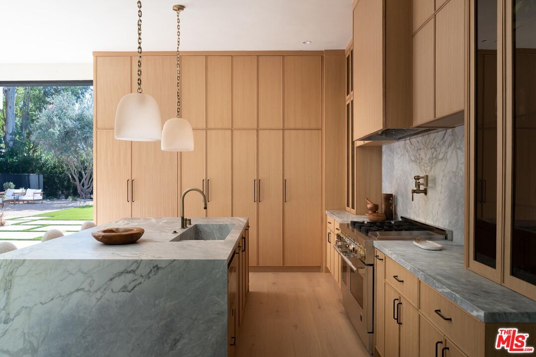 Interior, Kitchen, Marble Walls, Pendant Lights, Stainless Steel Appliances, Wood Texture Flooring