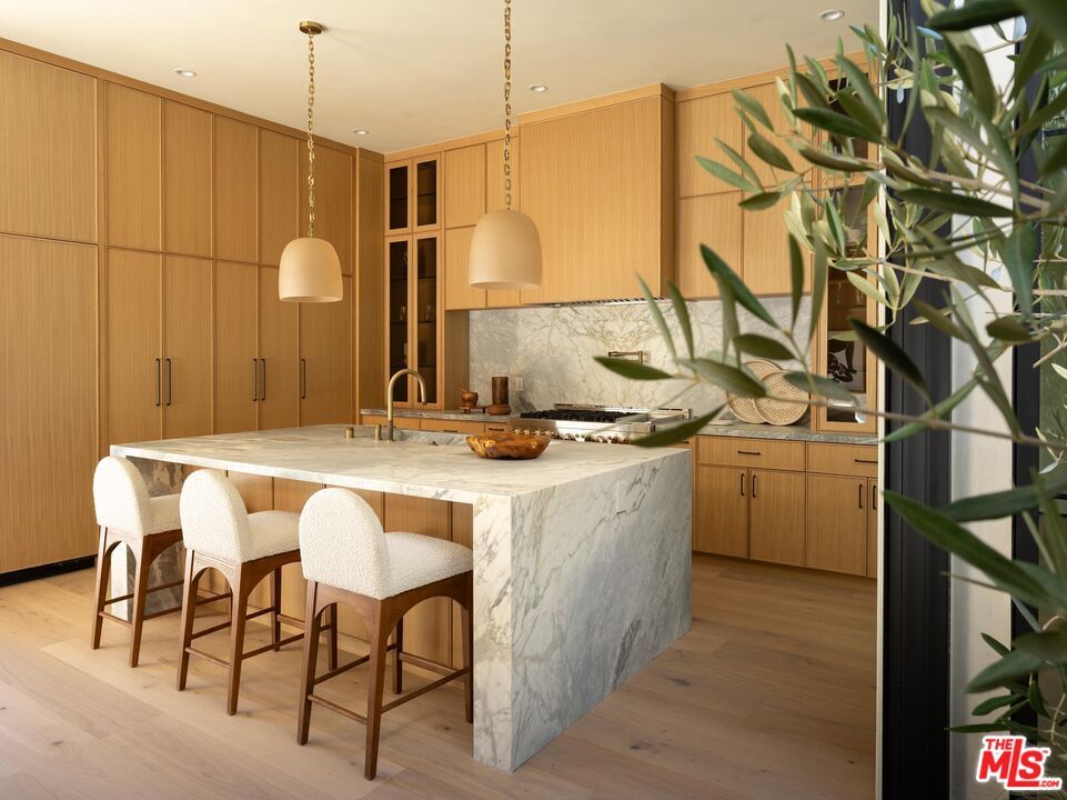 Interior, Kitchen, Marble Walls, Pendant Lights, Recessed Lighting, Stainless Steel Appliances, Wood Texture Flooring