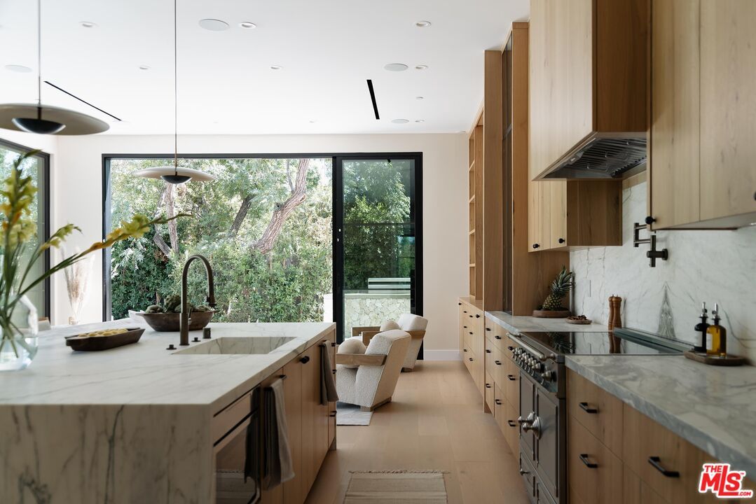 Interior, Kitchen, Marble Walls, Pendant Lights, Recessed Lighting, Wood Texture Flooring
