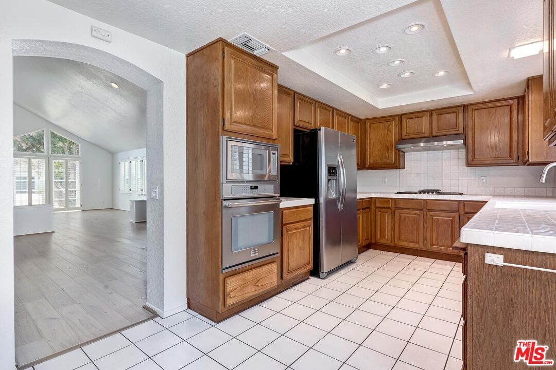 Interior, Kitchen, Recessed Lighting, Stainless Steel Appliances, Tile Countertops, Wood Texture Flooring