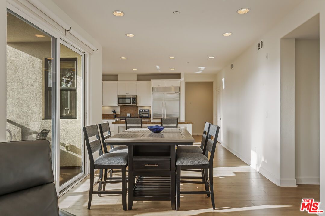 Dining room, Interior, Kitchen, Recessed Lighting, Stainless Steel Appliances, Wood Texture Flooring