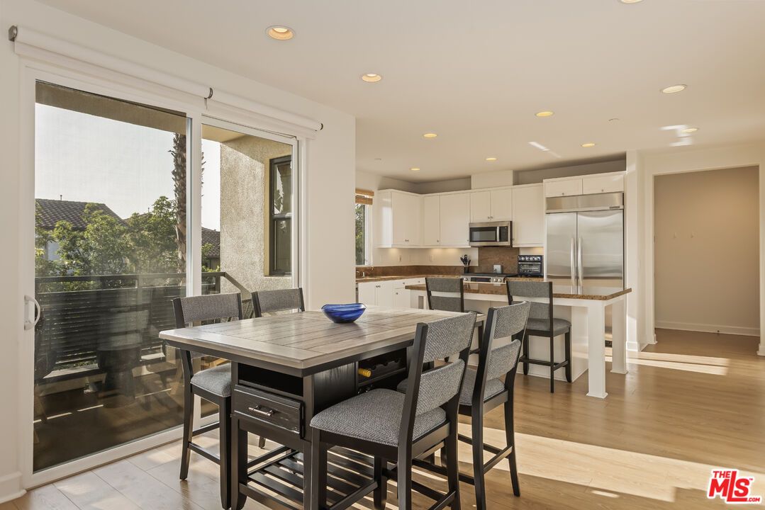 Dining room, Interior, Kitchen, Recessed Lighting, Stainless Steel Appliances, Wood Texture Flooring