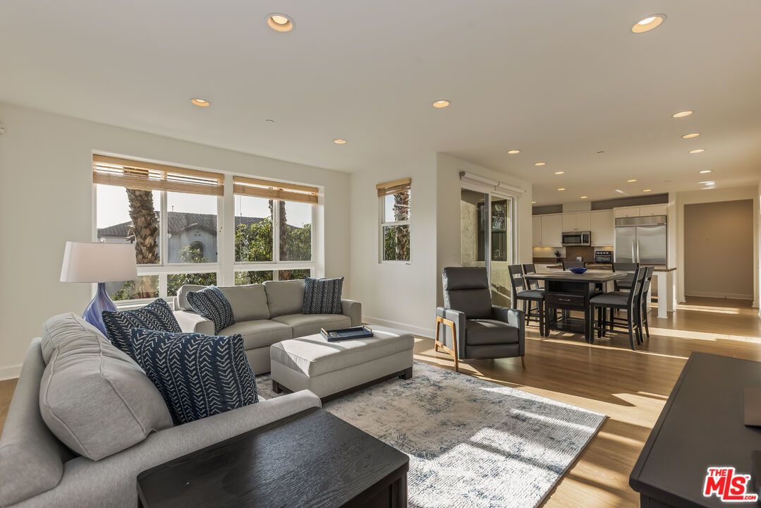 Dining room, Interior, Kitchen, Living room, Recessed Lighting, Stainless Steel Appliances, Wood Texture Flooring