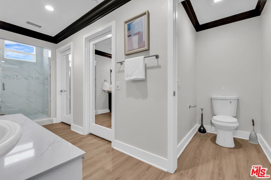 Bathroom, Glass Shower, Interior, Marble Walls, Recessed Lighting, Wood Texture Flooring