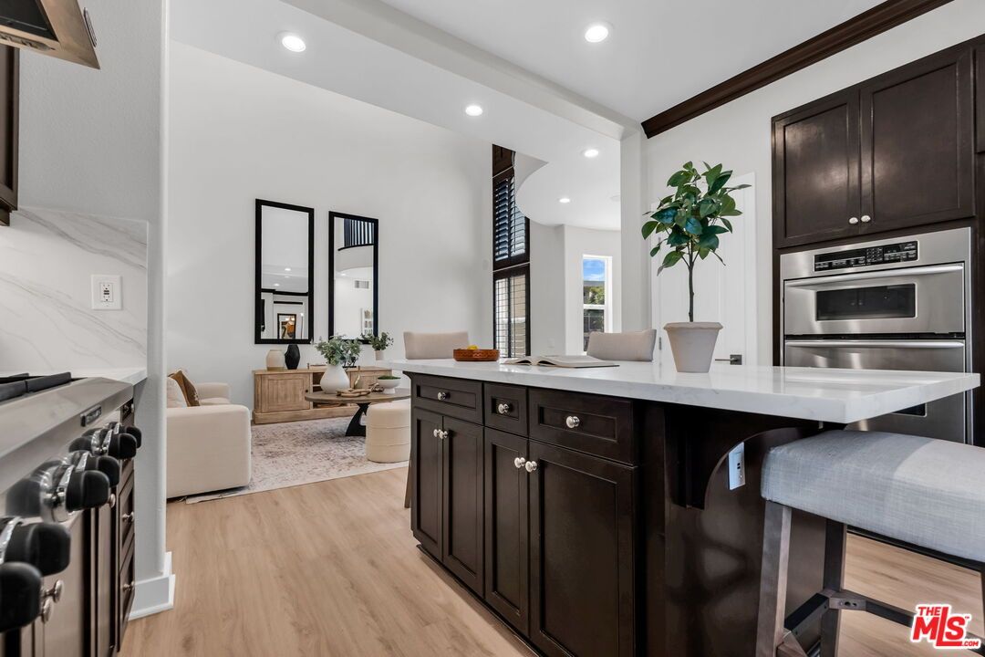 Interior, Kitchen, Living room, Marble Walls, Recessed Lighting, Stainless Steel Appliances, Wood Texture Flooring