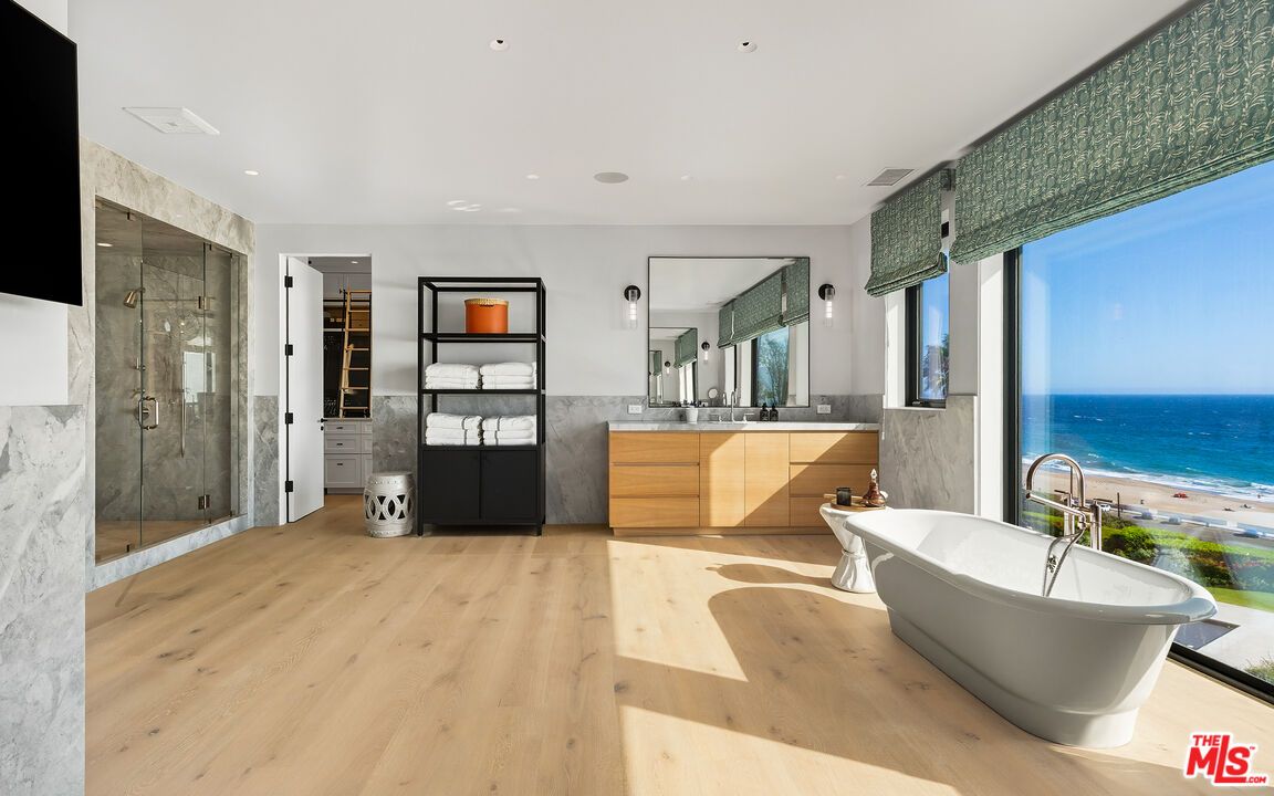 Bathroom, Dual Sink Vanities, Free Standing Baths, Glass Shower, Interior, Marble Walls, Recessed Lighting, Water, Wood Texture Flooring