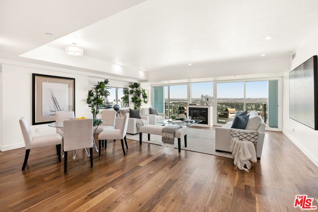 Dining room, Fireplace, Interior, Living room, Recessed Lighting, Wood Texture Flooring