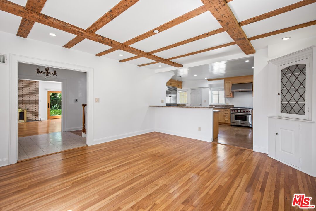 Empty room, Interior, Kitchen, Recessed Lighting, Stainless Steel Appliances, Wooden Beams, Wood Texture Flooring