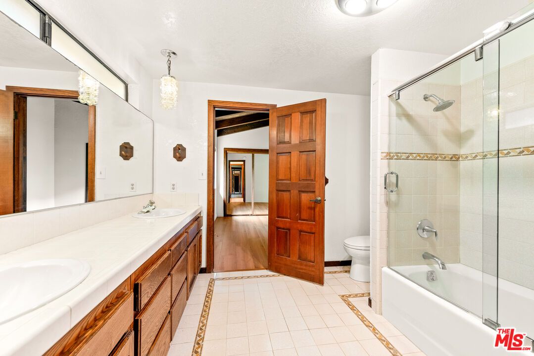 Bathroom, Dual Sink Vanities, Glass Shower, Interior, Tile Countertops, Wood Texture Flooring