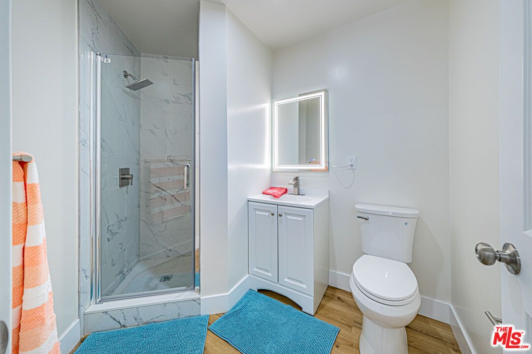 Bathroom, Glass Shower, Interior, Marble Walls, Wood Texture Flooring