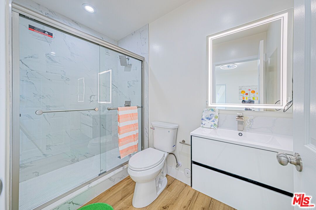 Bathroom, Glass Shower, Interior, Marble Walls, Recessed Lighting, Wood Texture Flooring