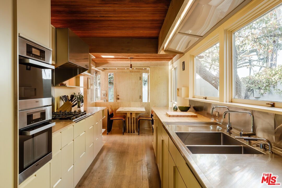 Chandelier, Dining room, Interior, Kitchen, Pendant Lights, Stainless Steel Appliances, Wooden Beams, Wooden Ceilings, Wood Texture Flooring