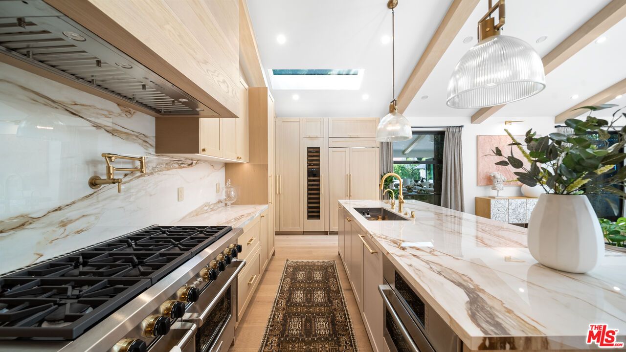 Interior, Kitchen, Marble Walls, Pendant Lights, Recessed Lighting, Stainless Steel Appliances, Wood Texture Flooring