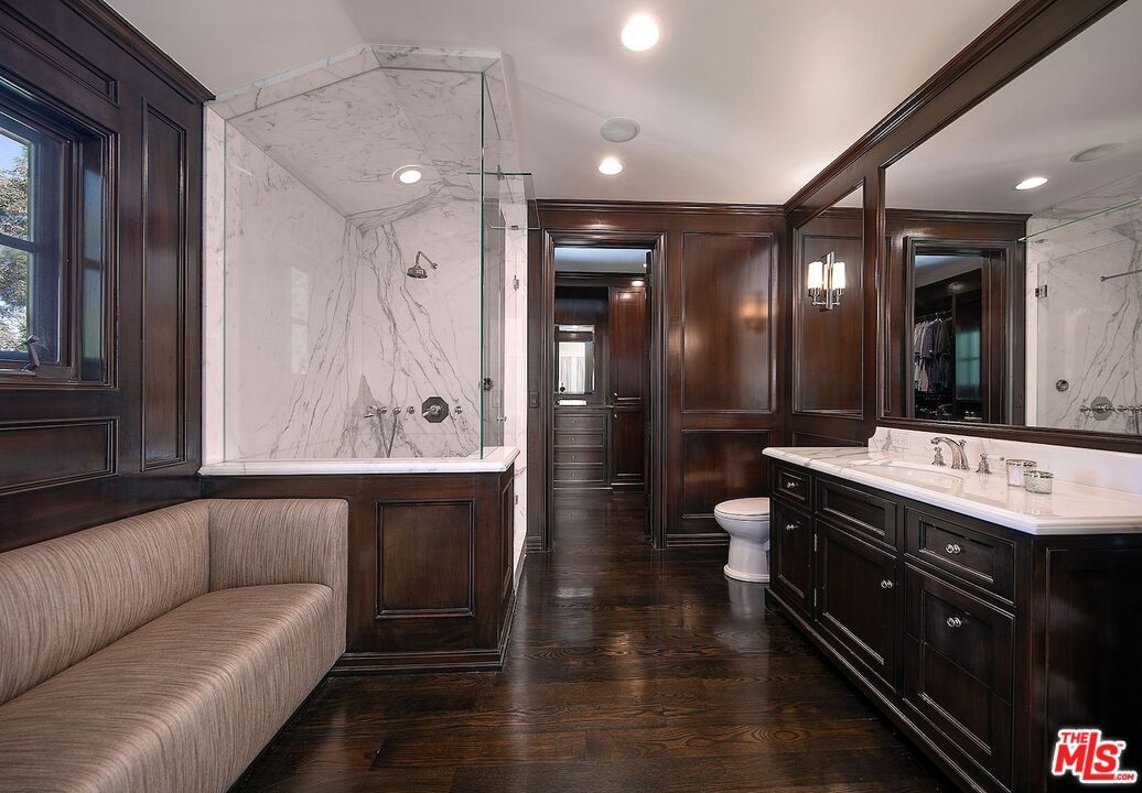 Bathroom, Dual Sink Vanities, Interior, Marble Walls, Recessed Lighting, Wood Texture Flooring