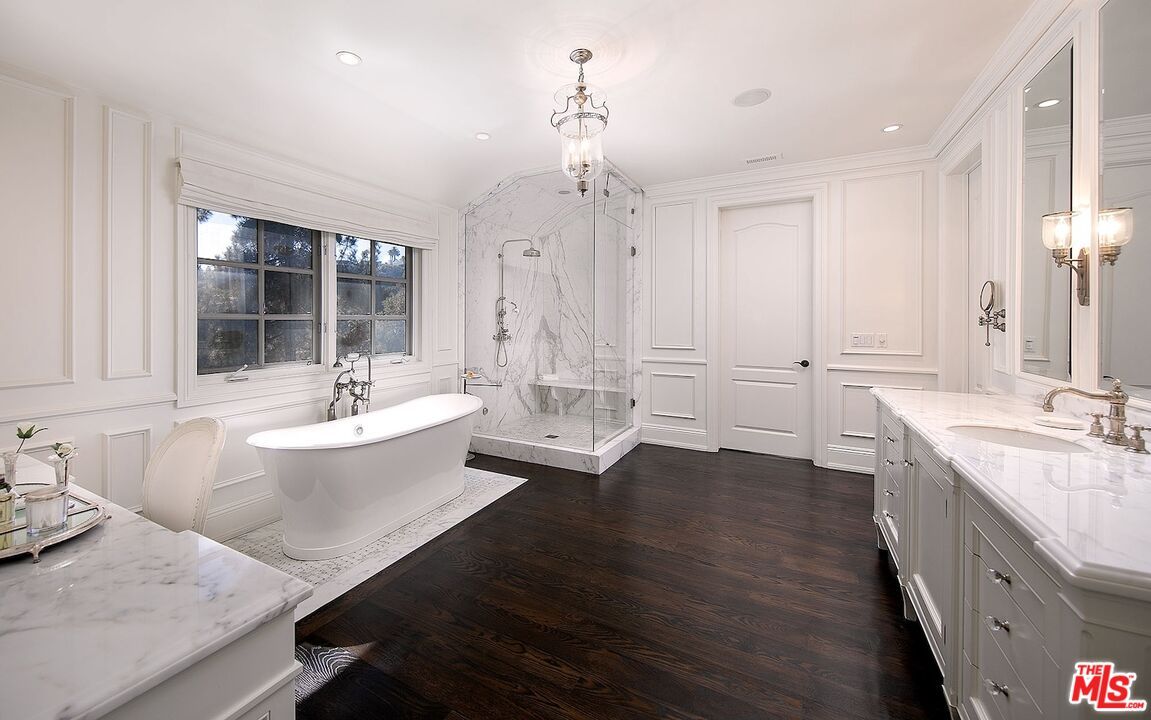 Bathroom, Chandelier, Dual Sink Vanities, Free Standing Baths, Glass Shower, Interior, Marble Walls, Pendant Lights, Recessed Lighting, Wood Texture Flooring