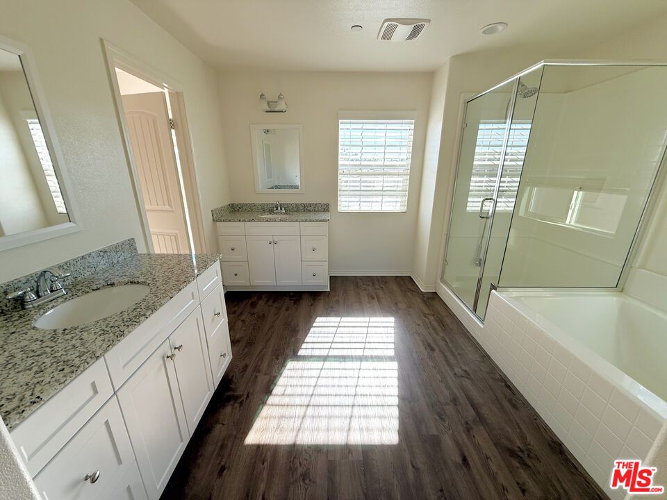 Bathroom, Dual Sink Vanities, Glass Shower, Interior, Recessed Lighting, Wood Texture Flooring