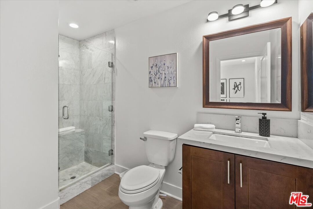 Bathroom, Glass Shower, Interior, Marble Walls, Recessed Lighting, Wood Texture Flooring