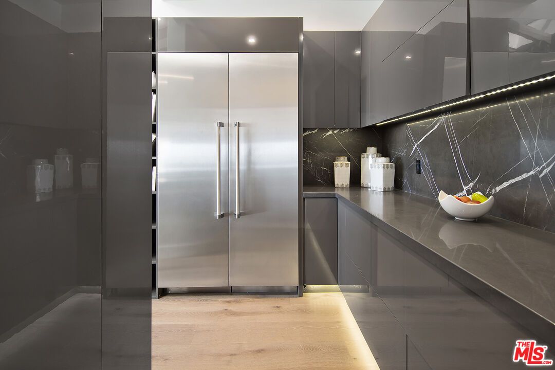 Interior, Kitchen, Marble Walls, Recessed Lighting, Stainless Steel Appliances, Wood Texture Flooring