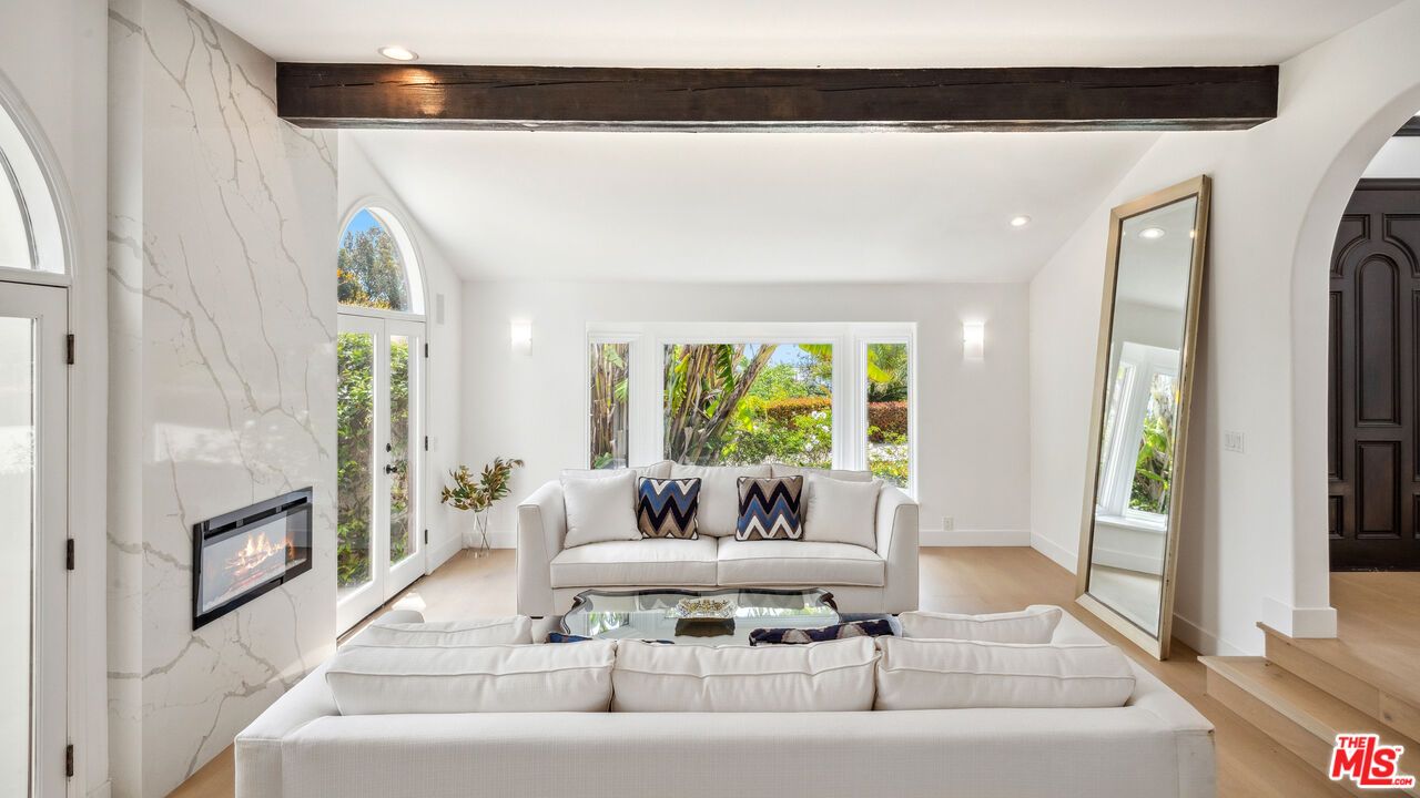 Fireplace, Interior, Living room, Marble Walls, Recessed Lighting, Wood Texture Flooring