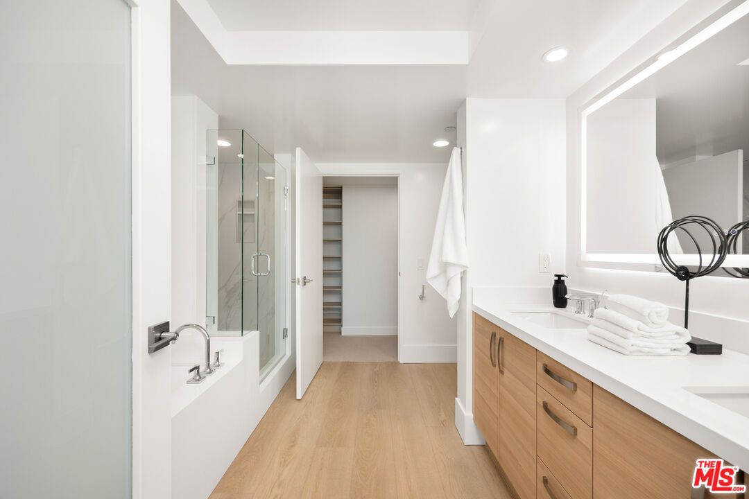 Bathroom, Dual Sink Vanities, Glass Shower, Interior, Recessed Lighting, Walk-in Closets, Wood Texture Flooring