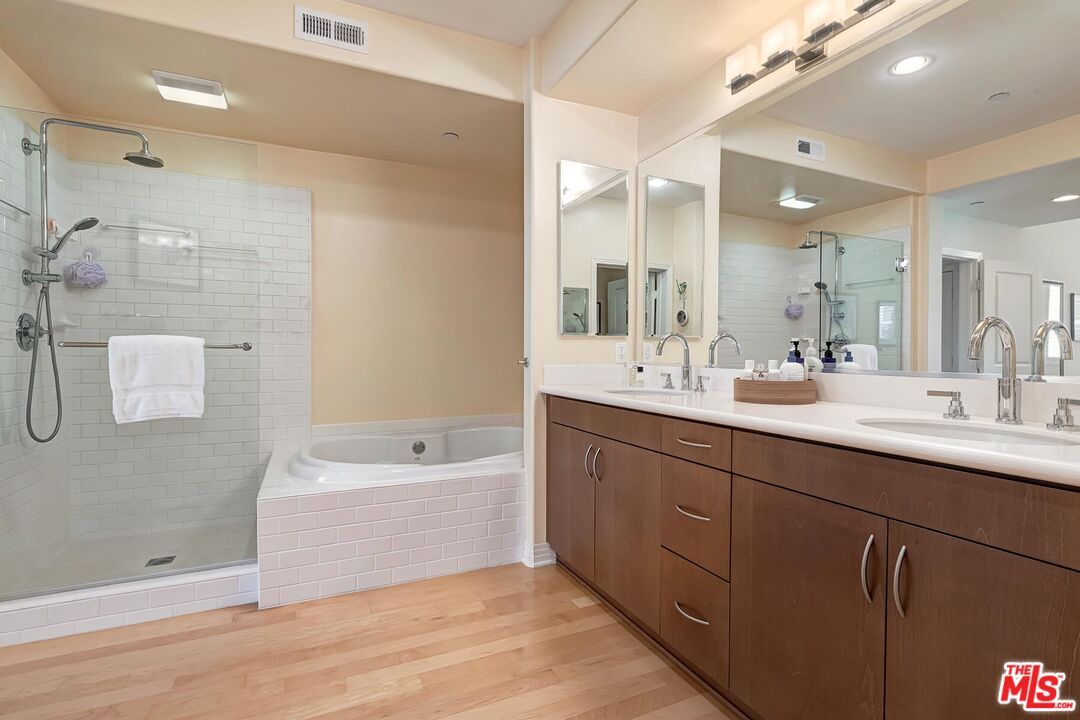 Bathroom, Dual Sink Vanities, Glass Shower, Interior, Recessed Lighting, Wood Texture Flooring