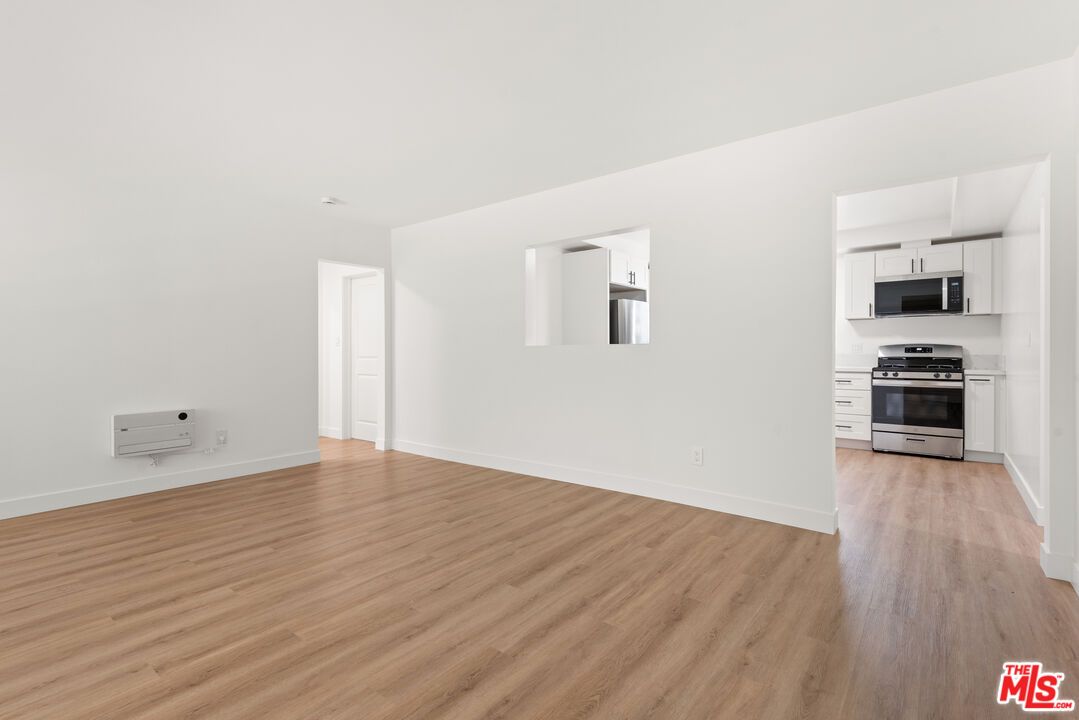 Empty room, Interior, Kitchen, Stainless Steel Appliances, Wood Texture Flooring