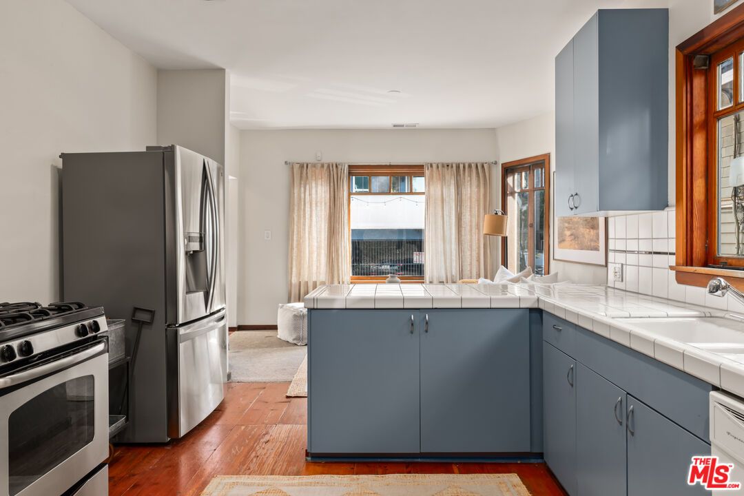 Interior, Kitchen, Stainless Steel Appliances, Tile Countertops, Wood Texture Flooring