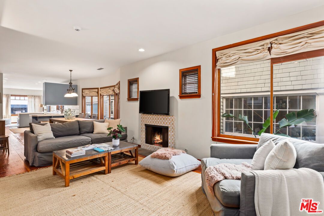 Dining room, Fireplace, Interior, Living room, Pendant Lights, Recessed Lighting, Wood Texture Flooring