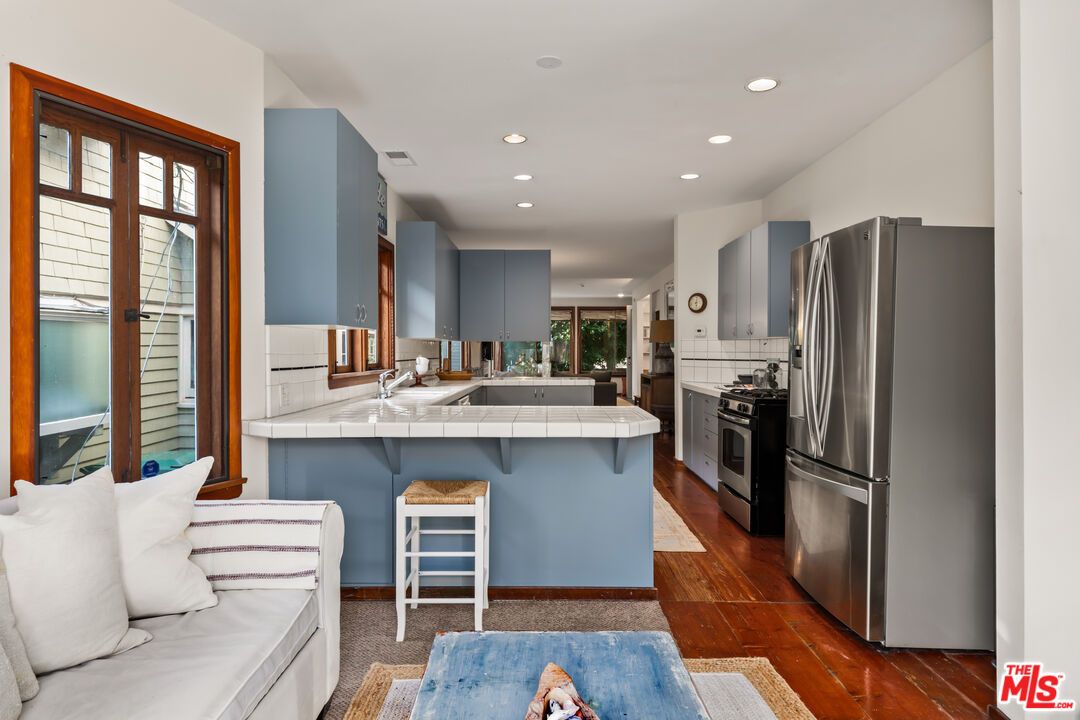 Interior, Kitchen, Recessed Lighting, Stainless Steel Appliances, Tile Countertops, Wood Texture Flooring