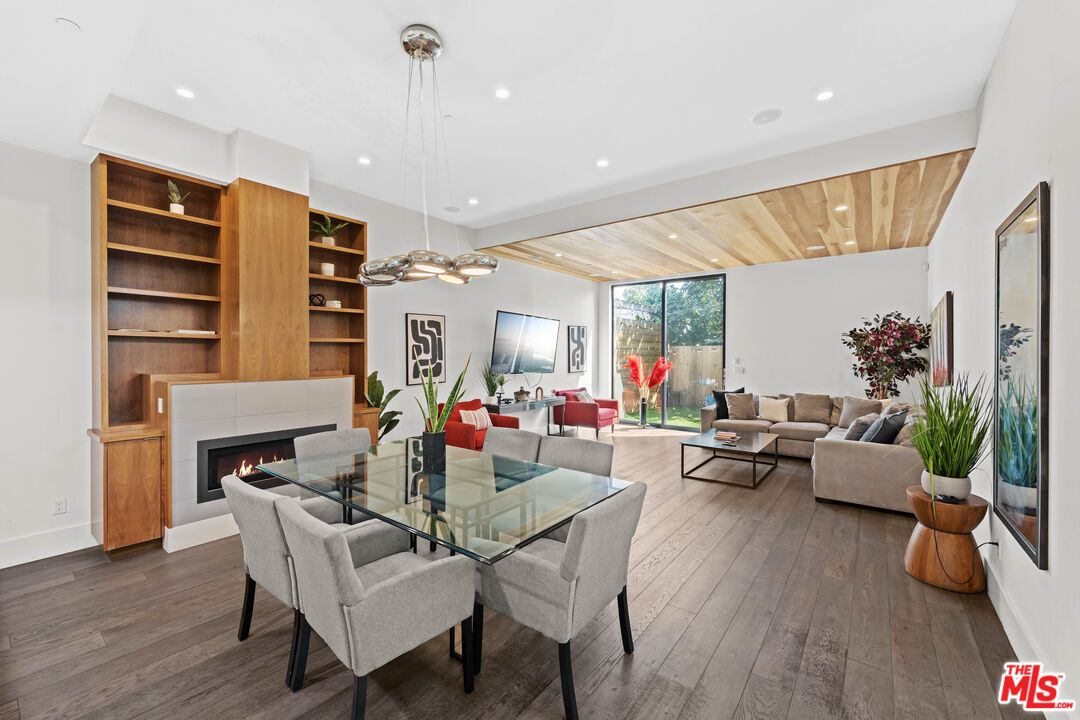 Dining room, Fireplace, Interior, Living room, Pendant Lights, Recessed Lighting, Wooden Ceilings, Wood Texture Flooring