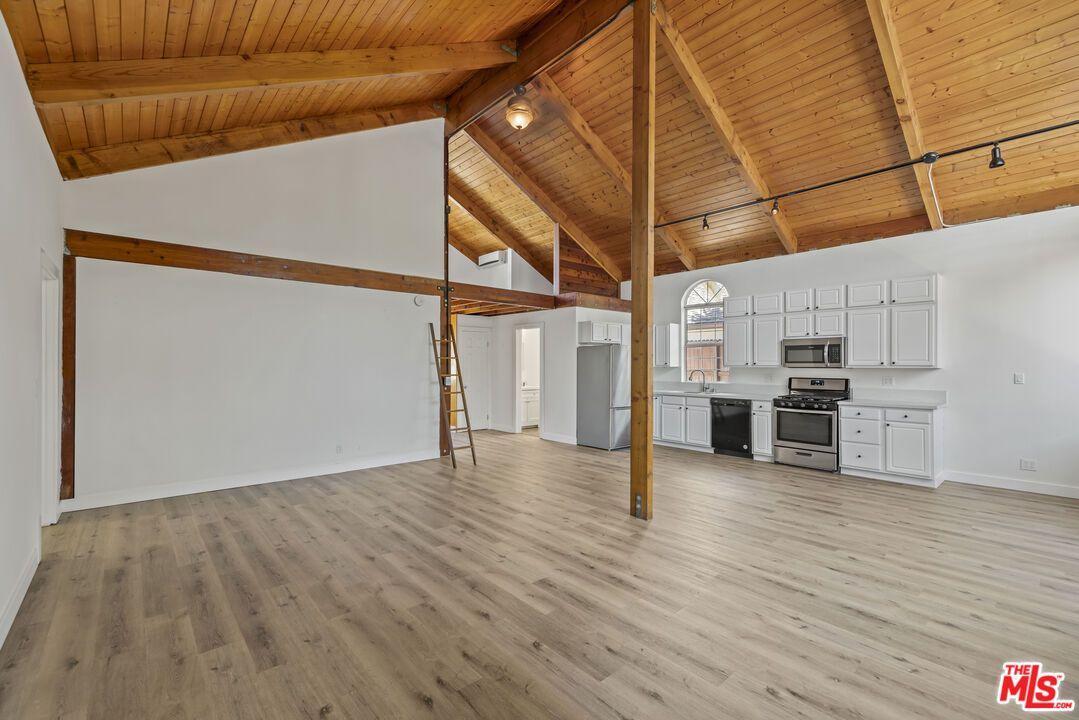 Empty room, Interior, Kitchen, Stainless Steel Appliances, Wooden Beams, Wooden Ceilings, Wood Texture Flooring