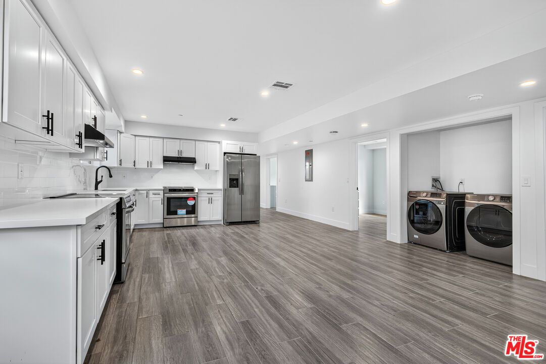 Interior, Kitchen, Recessed Lighting, Stainless Steel Appliances, Washer, Wood Texture Flooring