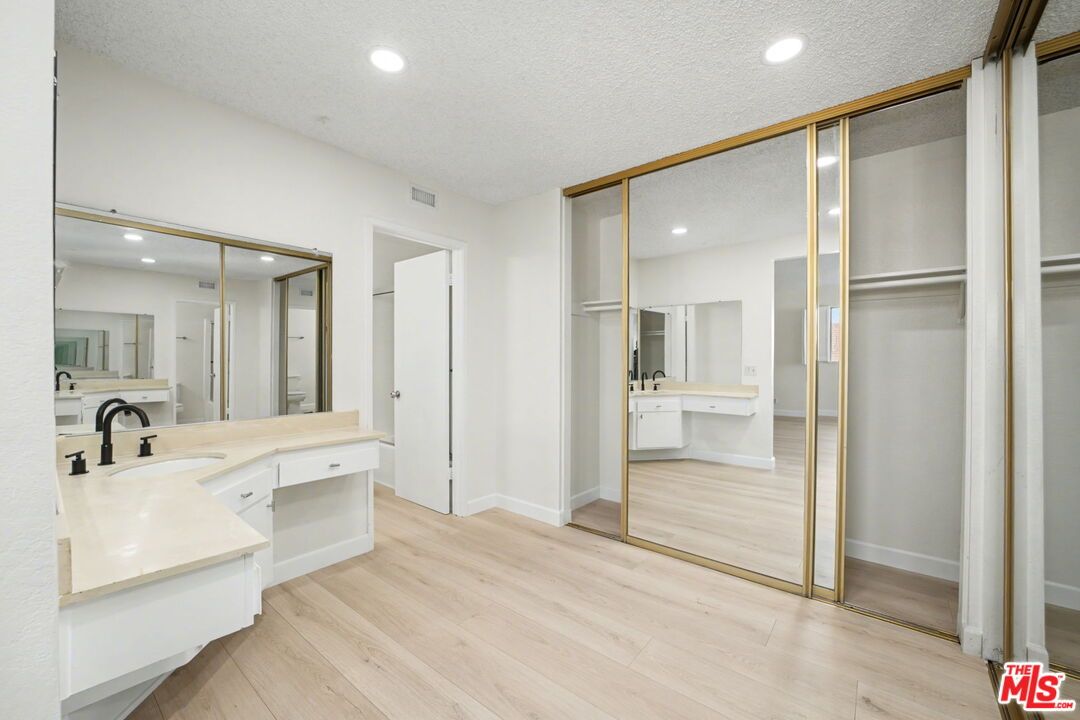 Bathroom, Dual Sink Vanities, Glass Shower, Interior, Recessed Lighting, Wood Texture Flooring