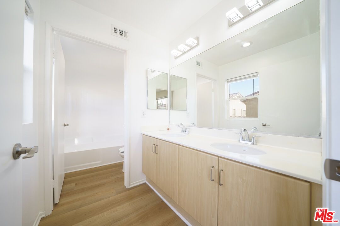 Bathroom, Dual Sink Vanities, Interior, Recessed Lighting, Wood Texture Flooring