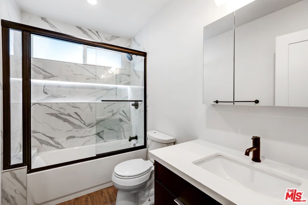 Bathroom, Glass Shower, Interior, Marble Walls, Recessed Lighting, Wood Texture Flooring